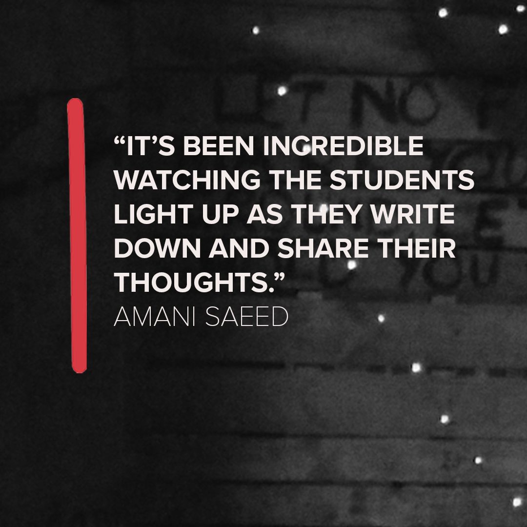 Image shows a black and white background with a quote in the centre, which says "It's been incredible watching the students light up as they write down and share their thoughts." Amani Saeed